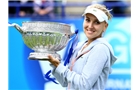 EASTBOURNE, ENGLAND - JUNE 22:  Elena Vesnina of Russia poses with the trophy after defeating Jamie Hampton of the USA in the women's singles final match during the day eight of the AEGON International tennis tournament at Devonshire Park on June 22, 2013 in Eastbourne, England.  (Photo by Jan Kruger/Getty Images)